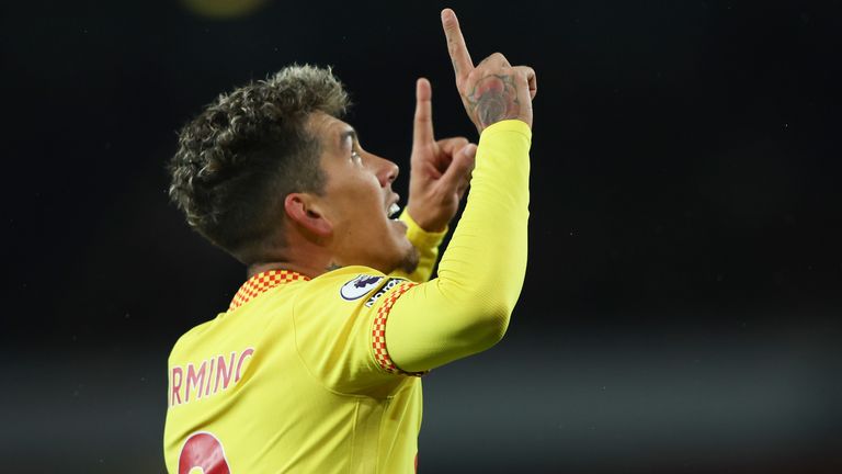 Roberto Firmino celebrates after his deft finish put Liverpool 2-0 up at Arsenal