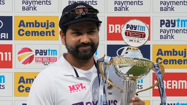 India's captain Rohit Sharma poses with the winners' trophy