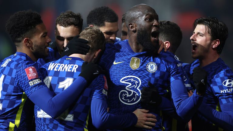 Romelu Lukaku is mobbed by his team-mates after putting Chelsea ahead at Luton