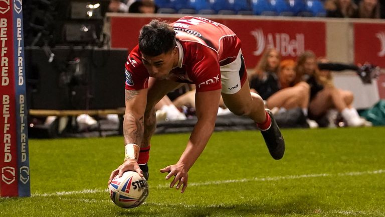 Salford Red Devils v Leeds Rhinos - Betfred Super League - Emerald Headingley Stadium
Salford Red Devils' Ken Sio scores his side's first try of the game during the Betfred Super League match at the Emerald Headingley Stadium, Leeds. Picture date: Friday March 18, 2022.