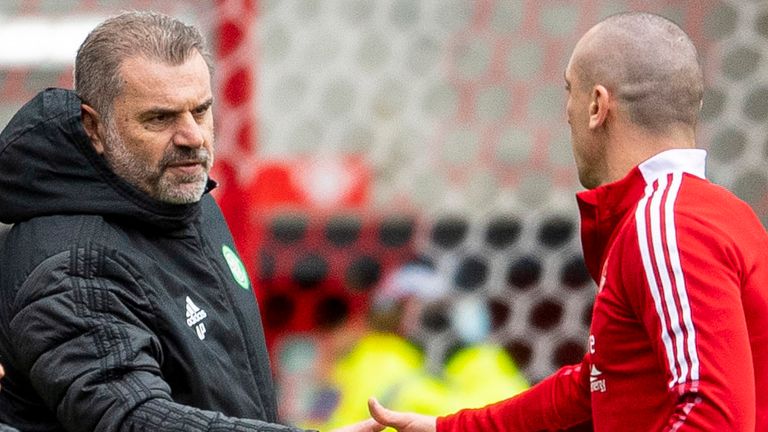 ABERDEEN, SCOTLAND - OCTOBER 03: Aberdeen...s Scott Brown with Celtic manager Ange Postecoglou at full time during the cinch Premiership match between Aberdeen and Celtic at Pittodrie Stadium on October 03, 2021, in Aberdeen, Scotland.  (Photo by Ross MacDonald / SNS Group)