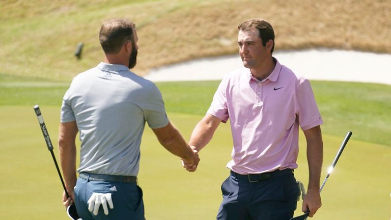 Scottie Scheffler, right, shakes hands after defeating Dustin Johnson, left, in the semifinal round of the Dell Technologies Match Play Championship golf tournament