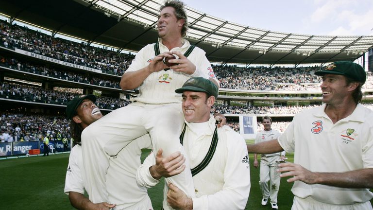 Shane Warne celebrates on the shoulders of Andrew Symonds and Matthew Hayden after Australia 's victory in the 2006 Melbourne Test