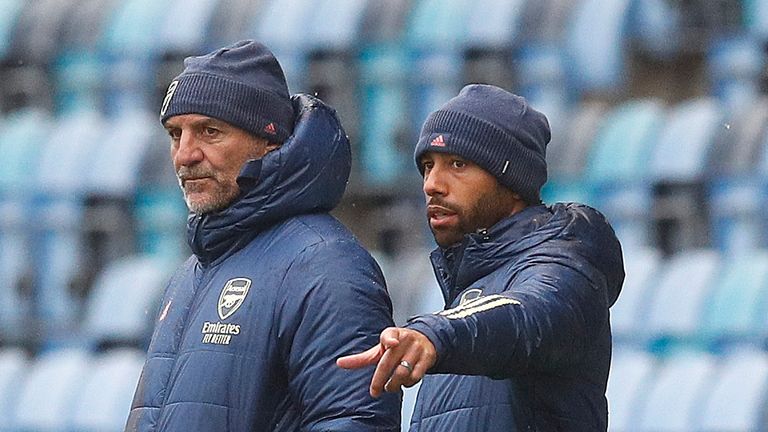 Steve Bould and Ryan Garry pictured watching an Arsenal U23 game in October 2020