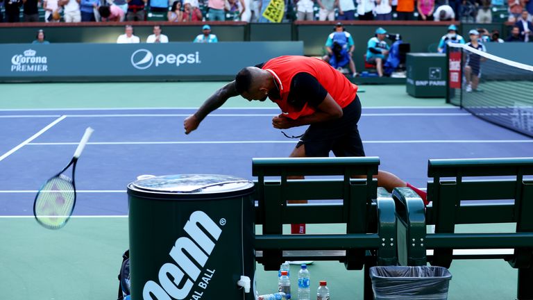 Nick Kyrgios of Australia smashes his racket after his three set defeat against Rafael Nadal of Spain in their quarterfinal match on Day 11 of the BNP Paribas Open at the Indian Wells Tennis Garden on March 17, 2022 in Indian Wells, California.