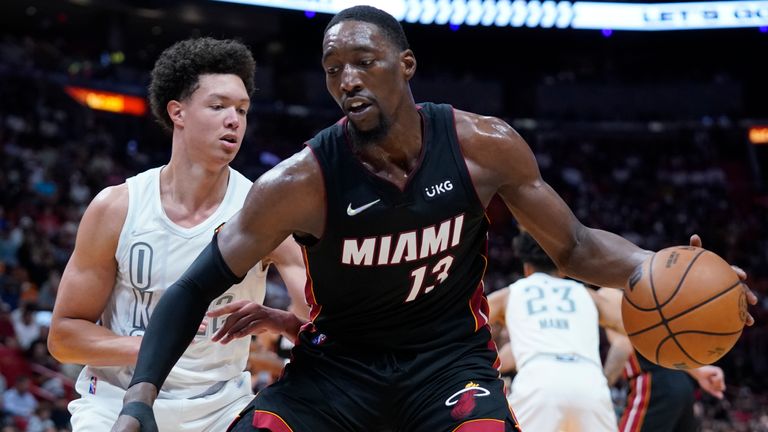 Miami Heat center Bam Adebayo (13) prepares to go up for a shot against Oklahoma City Thunder forward Isaiah Roby (22) during the second half of an NBA basketball game, Friday, March 18, 2022, in Miami. (AP Photo/Wilfredo Lee)


