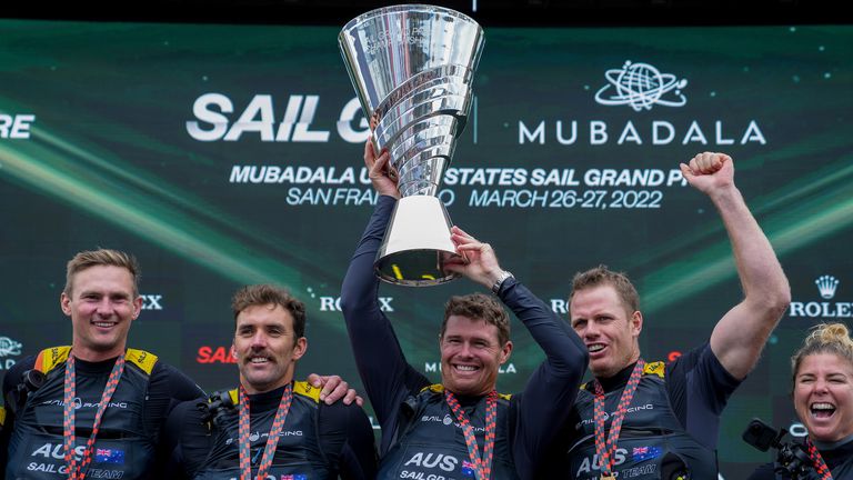 Tom Slingsby and the Australia SailGP Team on the podium with the Championship Trophy (Image credit: Bob Martin for SailGP)