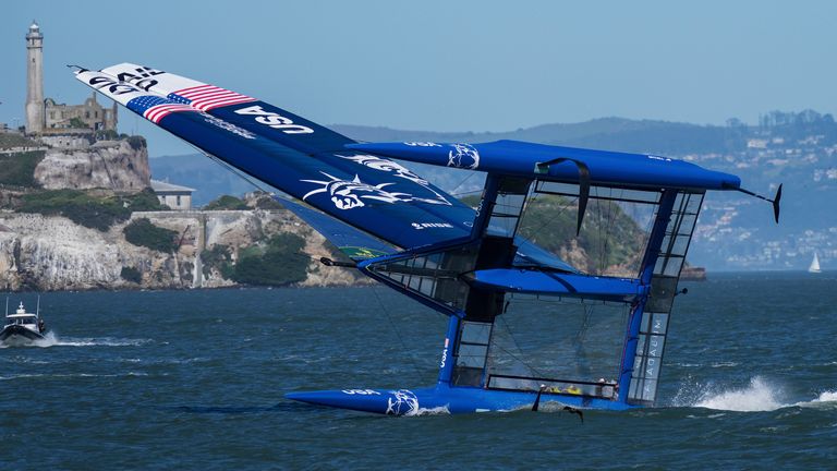 USA SailGP Team helmed by Jimmy Spithill capsize as they sail past Alcatraz Island during a practice session ahead of San Francisco SailGP, Season 2 in San Francisco, USA. 21st March 2022. Photo: Bob Martin for SailGP. Handout image supplied by SailGP