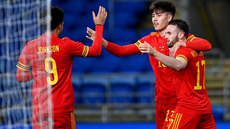 Wales' Rubin Colwill celebrates with his team-mates after scoring their side's first goal