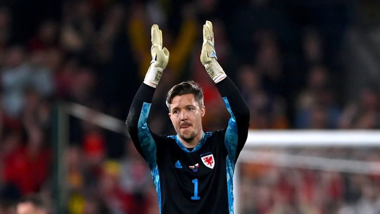 Wales goalkeeper Wayne Hennessey applauds the fans