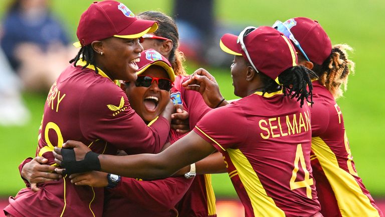 West Indies players celebrate their victory at the end of the Round 2 Women&#39;s Cricket World Cup match between England and West Indies at University Oval in Dunedin on March 9, 2022. (Photo by Sanka Vidanagama / AFP) (Photo by SANKA VIDANAGAMA/AFP via Getty Images)