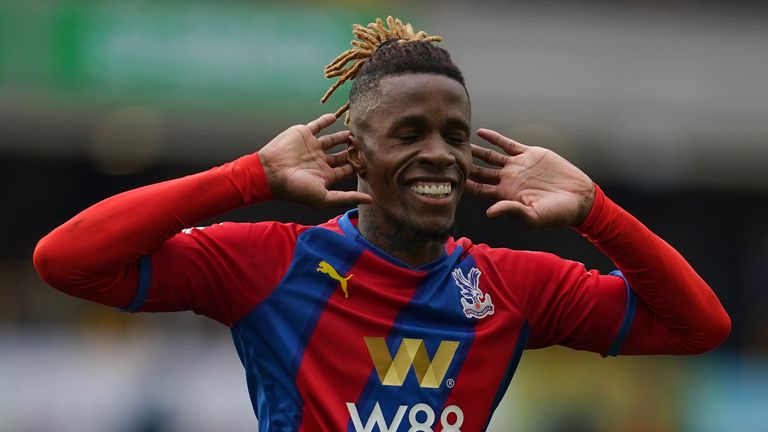 Crystal Palace&#39;s Wilfried Zaha celebrates with his eyes shut after doubling their lead