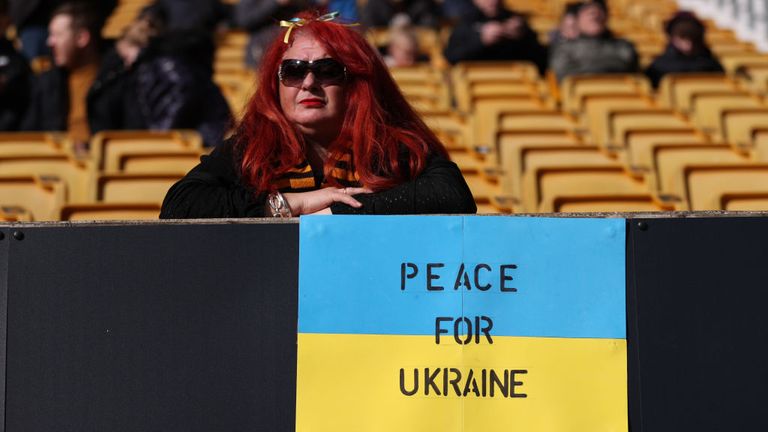 A fan shows her support for Ukraine at Molineux