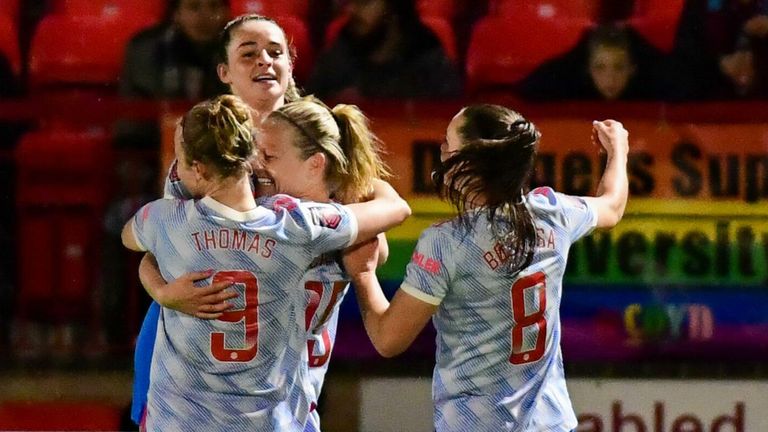 Ella Toone is mobbed by her team-mates after opening the scoring for Manchester United