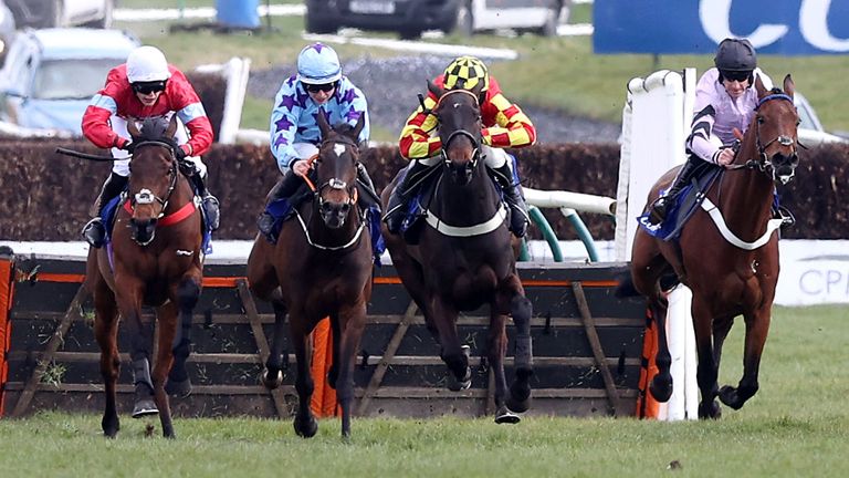 Anna Bunina (blue silks) wins the Coral Scottish Champion Hurdle