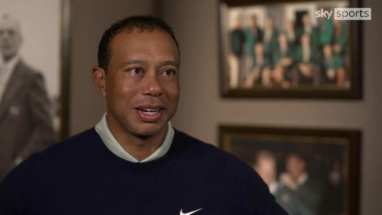 Tiger Woods says winning one of golf's four majors elevates players into higher levels of respect from their peers