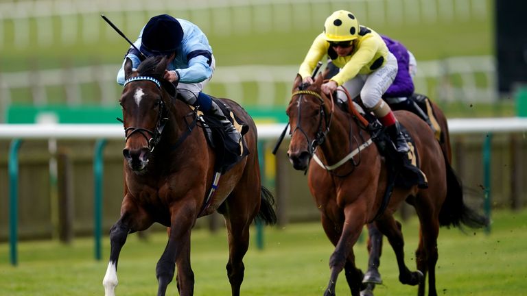 Cachet ridden by jockey William Buick (left) on their way to winning the Lanwades Stud Nell Gwyn Stakes 