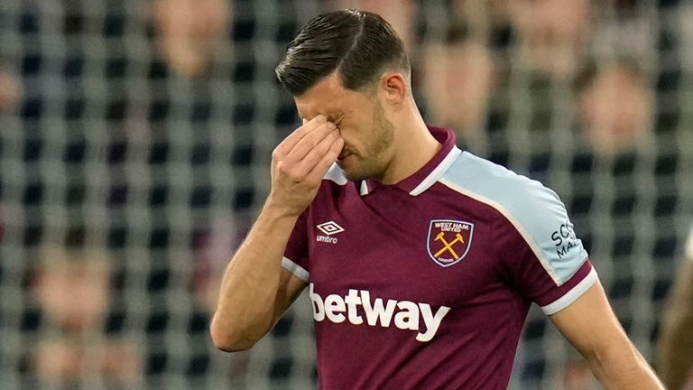 West Ham's Aaron Cresswell leaves the pitch after being shown a red card