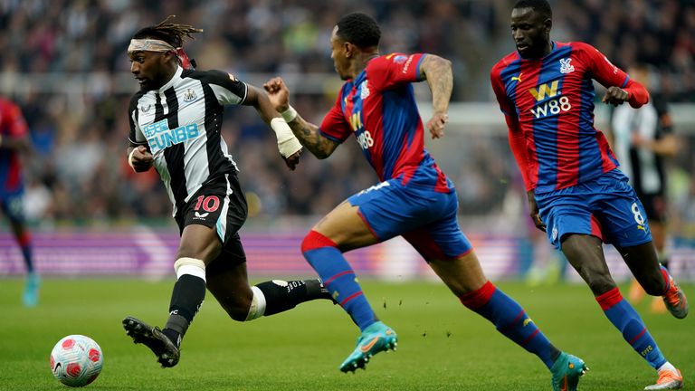 Newcastle United's Allan Saint-Maximin (left) is trailed by Crystal Palace's Nathaniel Clyne (centre) and Cheikhou Kouyate