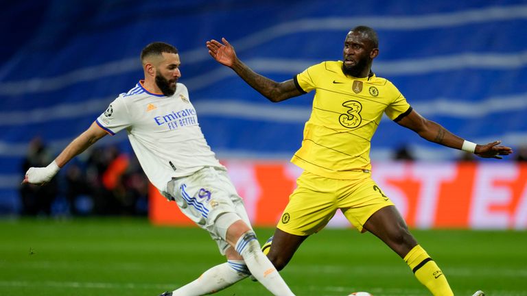 Real Madrid&#39;s Karim Benzema, left, and Chelsea&#39;s Antonio Rudiger fight for the ball during the Champions League, quarterfinal second leg soccer match between Real Madrid and Chelsea at the Santiago Bernabeu stadium in Madrid, Spain.