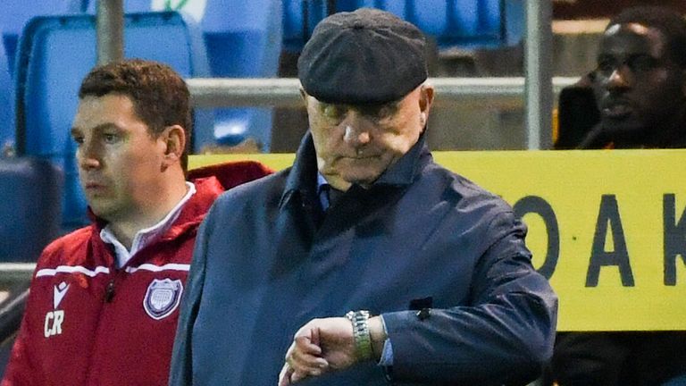 KILMARNOCK, SCOTLAND - APRIL 22: Arbroath manager Dick Campbell checks his watch during a cinch Championship match between Kilmarnock and Arbroath at Rugby Park, on April 22, 2022, in Kilmarnock, Scotland.  (Photo by Craig Foy / SNS Group)
