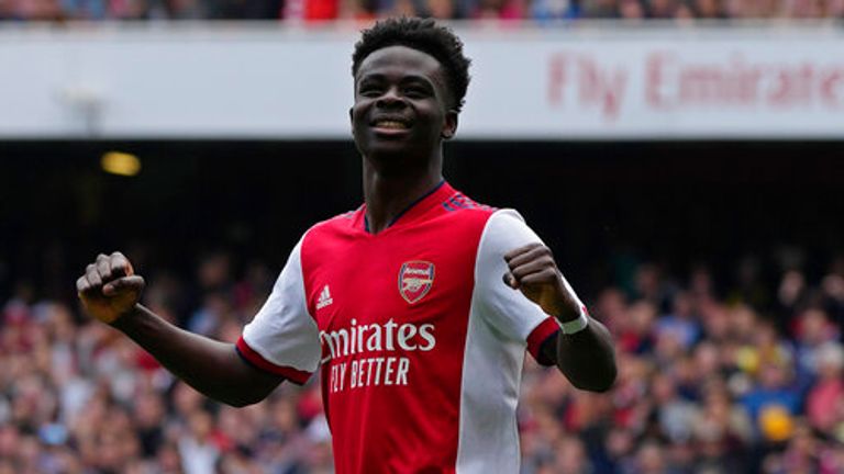 Bukayo Saka celebrates after scoring from the penalty spot