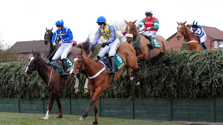 Little Josh and SamJohn Smith's Gr Twiston-Davies clear Becher's Brook during the 2013 Grand National