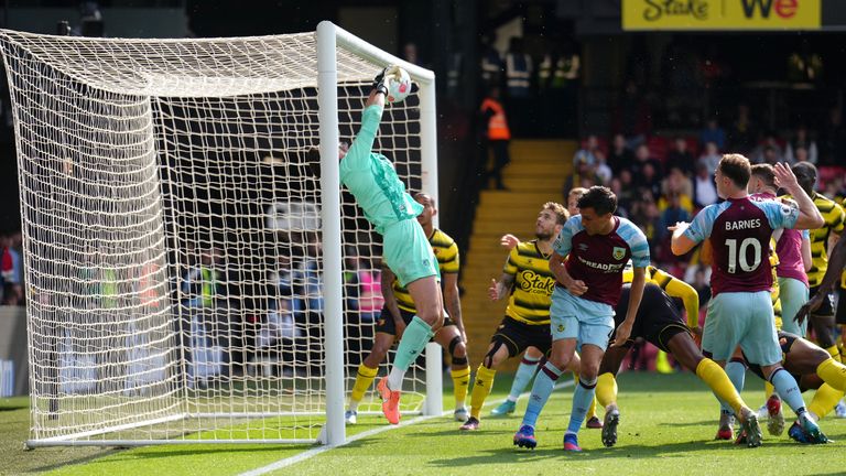 Burnley's Ashley Barnes (right) attempts a shot on goal but is blocked by Watford goalkeeper Ben Foster