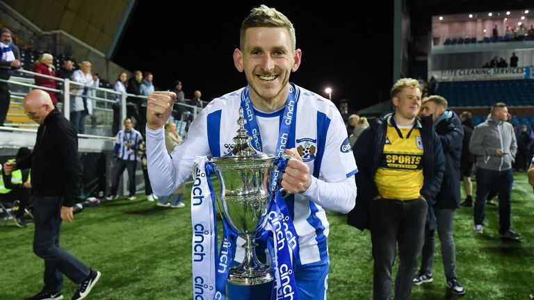 KILMARNOCK, SCOTLAND - APRIL 22: Kilmarnock&#39;s Blair Alston with the league trophy at full time during a cinch Championship match between Kilmarnock and Arbroath at Rugby Park, on April 22, 2022, in Kilmarnock, Scotland.  (Photo by Craig Foy / SNS Group)