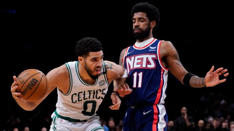 Boston Celtics forward Jayson Tatum (0) drives against Brooklyn Nets guard Kyrie Irving (11) during the second half of Game 4 of an NBA basketball first-round playoff series, Monday, April 25, 2022