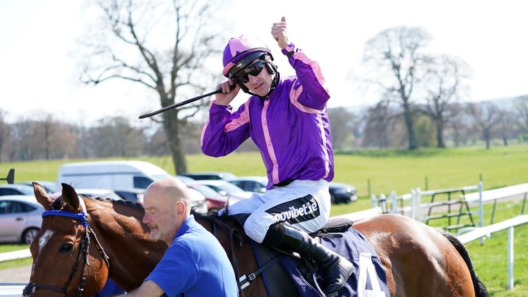 Brian Hughes celebrates after Dream Of Home provides him with his 200th winner of the 2021/22 season