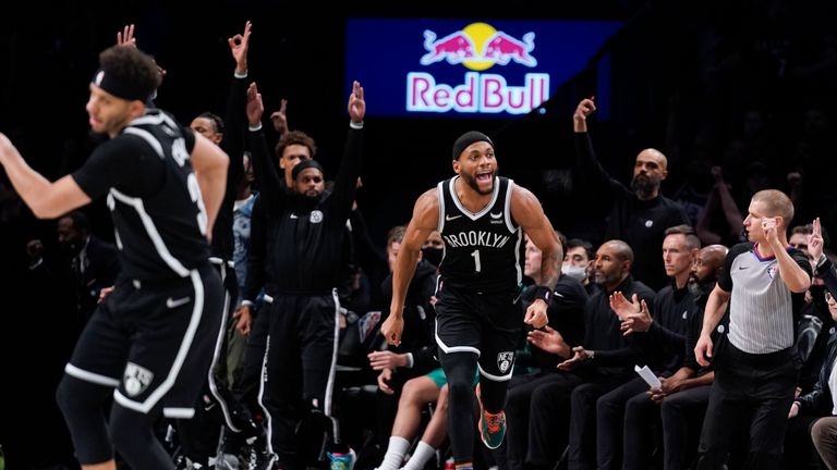 Brooklyn Nets&#39; Bruce Brown (1) reacts after a 3-point basket during the first half against the Cleveland Cavaliers in the opening basketball game of the NBA play-in tournament, Tuesday, April 12, 2022, in New York. (AP Photo/Seth Wenig)