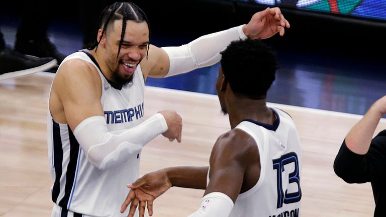 Memphis Grizzlies forward Dillon Brooks (24) celebrates with forward Jaren Jackson Jr. (13) after the Grizzlies the Minnesota Timberwolves in Game 6 of an NBA basketball first-round playoff series Friday, April 29, 2022, in Minneapolis.