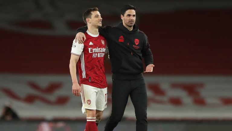 Cedric (left) with Arsenal manager Mikel Arteta