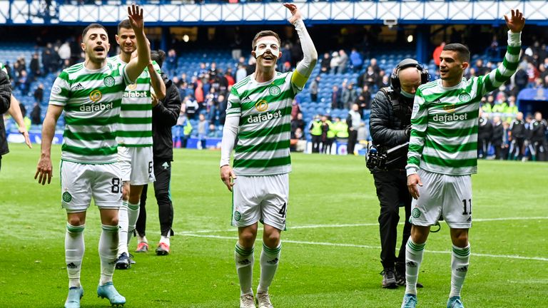 GLASGOW, SCOTLAND - APRIL 03: Celtic&#39;s Josip Juranovic (L), Callum McGregor (C) and Liel Abada celebrate at full time during a cinch Premiership match between Rangers and Celtic at Ibrox Stadium, on April 02, 2022, in Glasgow, Scotland.  (Photo by Rob Casey / SNS Group)
