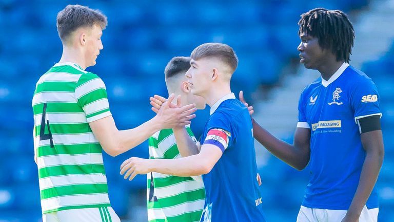 GLASGOW, SCOTLAND - MARCH 19: Celtic's Dane Murray (L) shakes hands with Rangers Robbie Fraser (Centre) and Johnly Yfeko (R) during a Lowland League match between Rangers B and Celtic B at Ibrox Stadium, on March 19, 2022, in Glasgow, Scotland.  (Photo by Roddy Scott / SNS Group)