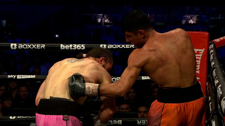Dylan Cheema punches Rylan Charlton in the BOXXER Lightweight Series Final