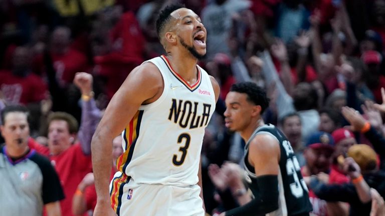 New Orleans Pelicans guard CJ McCollum reacts with the crowd after scoring a 3-pointer basket in the first half of the NBA play-in clash against the San Antonio Spurs