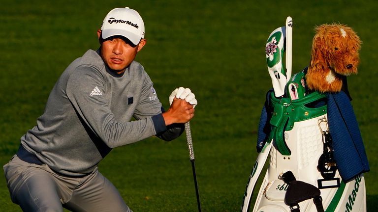 Collin Morikawa stretches before hitting on the driving range during a practice round for the Masters golf tournament on Monday, April 4, 2022, in Augusta, Ga. (AP Photo/Matt Slocun) 