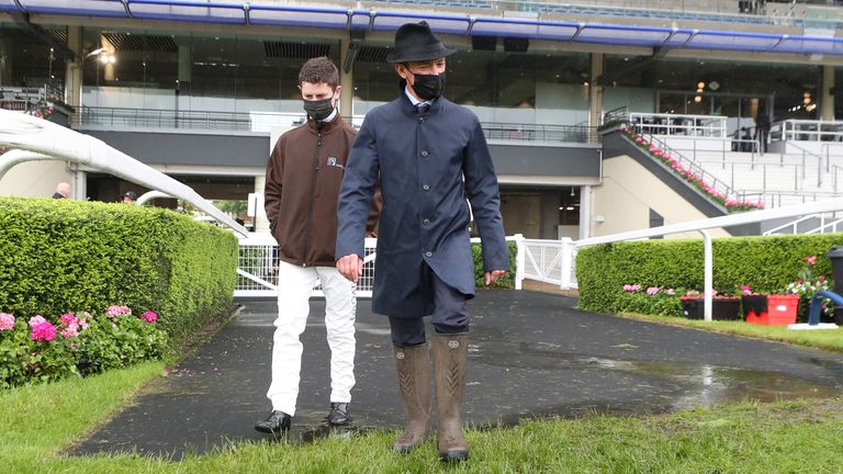 Dettori (right) and Oisin Murphy head out to walk the track at Ascot