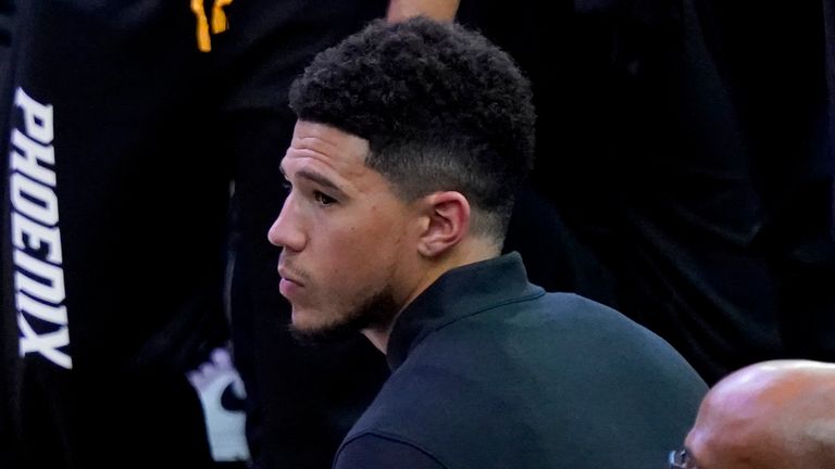 Phoenix Suns guard Devin Booker sits on the bench during the second half of Game 2