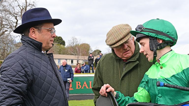 Colin Keane and trainer Ger Lyons (left) hold a debrief after Dr Zempf's victory at Leopardstown