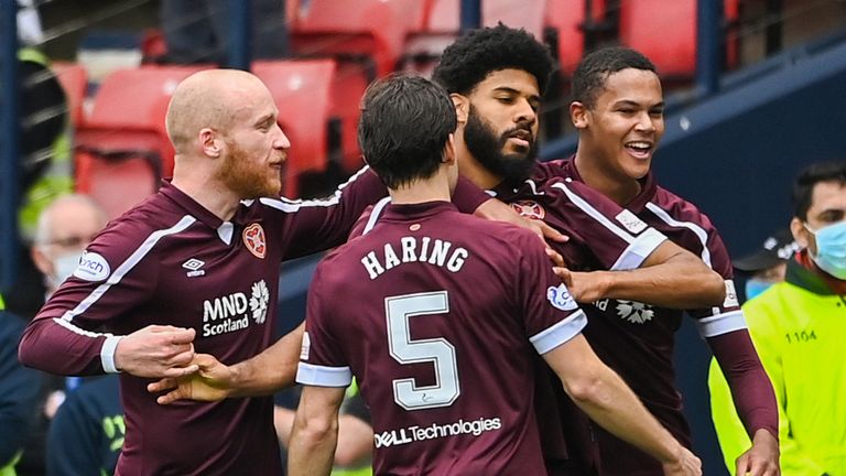 Hearts players celebrate after Ellis Simms (C) makes it 2-0 during a Scottish Cup Semi-Final