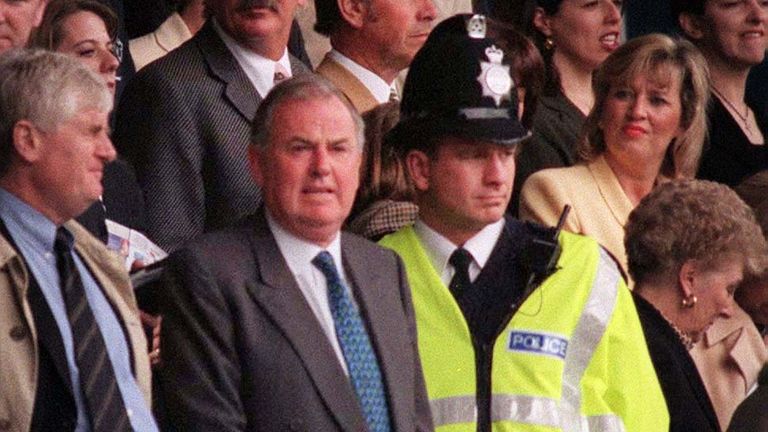 Everton Chairman Peter Johnson (centre) with a police guard at the vital match between his team and Coventry at Goodison Park today (Sunday). Everton went onto successfully maintain their position in the Premiership with a final score of 1-1. Photo Dave Kendall/PA.
