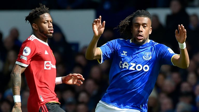 Fred and Alex Iwobi battle for the ball during Everton vs Man Utd