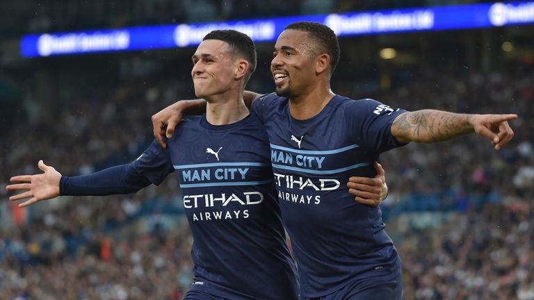 Gabriel Jesus celebrates with Phil Foden after scoring his side&#39;s third goal (AP)