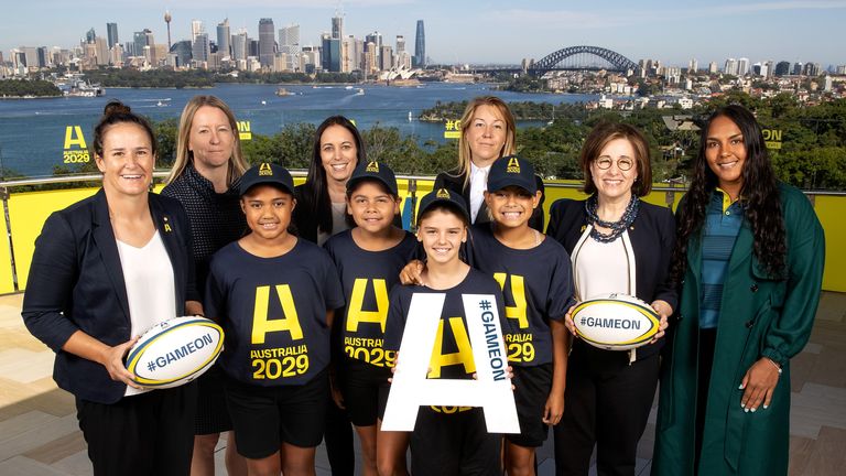 SYDNEY, AUSTRALIA - APRIL 04: (L to R) Shannon Parry of the Wallaroos, Jilly Collins of Rugby Australia, Alicia Keough of the Bid team, Olivia Wirth of the Bid Advisory Board, Josephine Sukkar and Mahalia Murphy (r) of the Wallaroos pose with junior rugby players during an Australian Rugby World Cup Bid Media Opportunity at Taronga Zoo on April 04, 2022 in Sydney, Australia. (Photo by Mark Kolbe/Getty Images for Rugby Australia)