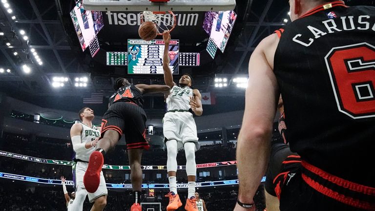Milwaukee Bucks&#39; Giannis Antetokounmpo dunks over Chicago Bulls&#39; Patrick Williams during the first half of Game 1 of their first round NBA playoff basketball game Sunday, April 17, 2022, in Milwaukee.