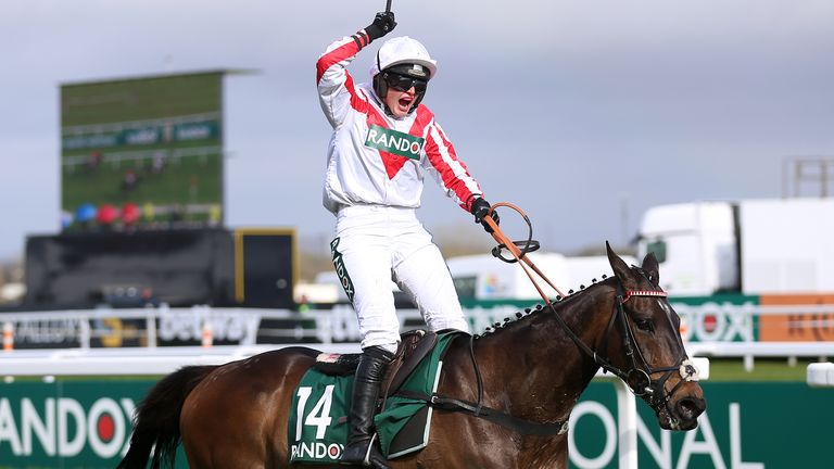 Gina Andrews lets out a roar as Latenightpass wins the Foxhunters' at Aintree