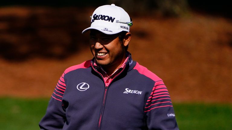 Hideki Matsuyama, of Japan, waits to hit on the driving range during a practice round for The Masters